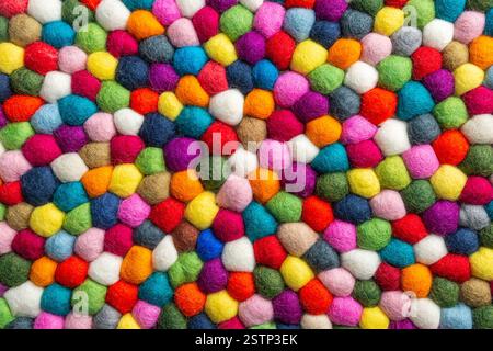 Multicolored felt ball rug detail Stock Photo