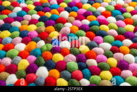 Multicolored felt ball rug detail Stock Photo