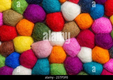 Multicolored felt ball rug detail Stock Photo