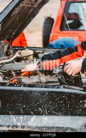 Jump-Starting the Dead Battery using jumper electrical wires. Stock Photo