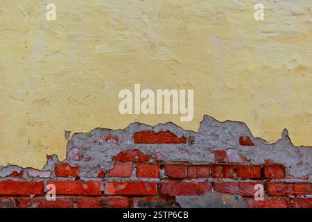 Half plastered wall with beach on beneath Stock Photo