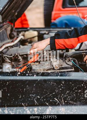 Jump-Starting the Dead Battery using jumper electrical wires. Stock Photo