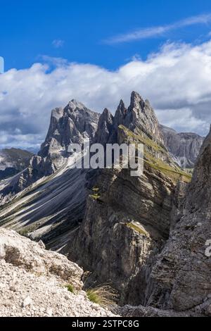 Sharp and towering rock peaks Dolomites rise dramatically against sky ...