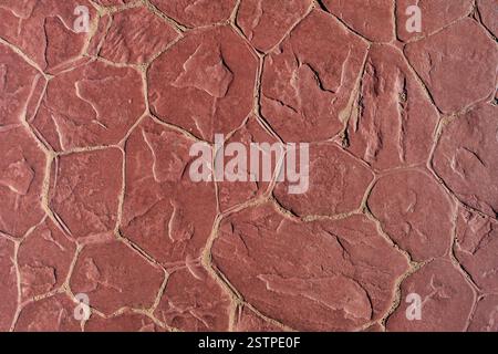 Red stone natural texture background. Close up texture and natural patterns, rustic background perfect for design projects. Mock up. Stock Photo