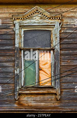 Worn wooden window in slums Stock Photo
