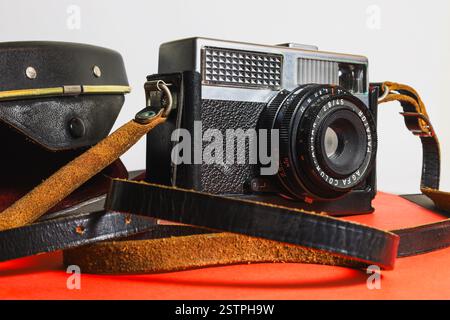Athens, Greece - feb 17, 2025- Vintage camera with leather strap and protective case Stock Photo