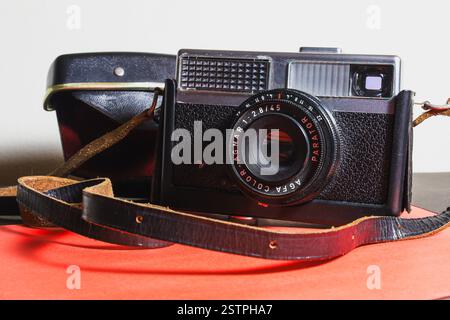 Athens, Greece - feb 17, 2025- Vintage camera with leather strap and protective case Stock Photo