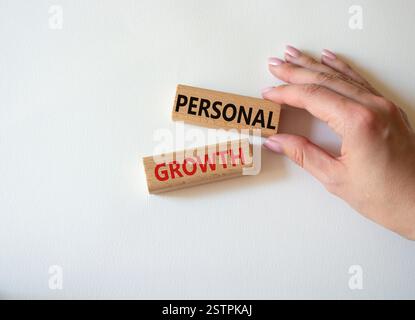 Personal growth symbol. Wooden blocks with words Personal growth. Beautiful white background. Businessman hand. Business and Personal growth concept. Stock Photo