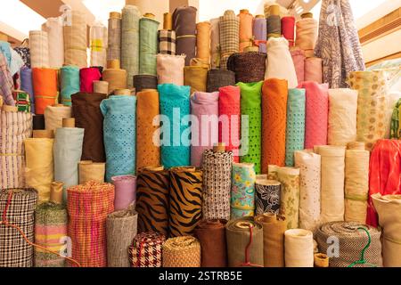 Colourful Textile Material in Rolls at Wholesaler Stock Photo - Alamy