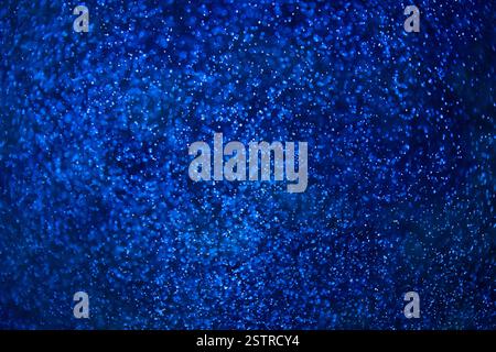 Dark blue water and small bubbles bokeh Stock Photo