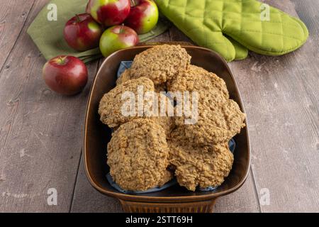 Homemade Oatmeal Cookies with Fresh Apples on Rustic Table Stock Photo