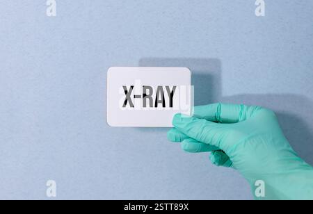 wooden cubes with x-ray text on a white grey glossy background with reflection. Stock Photo