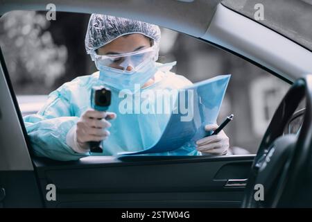 Doctor woman use infrared thermometer gun to check body temperature ...