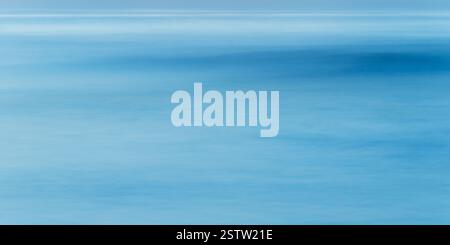Long exposure of sea water, blue abstract background Stock Photo