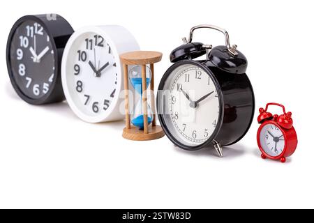 Vintage black alarm clock and modern clock on white background Stock Photo