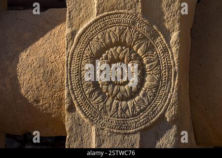 Round decorative carving depicting a lotus flower Stock Photo