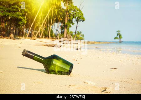 The glass bottle on the beach. Stock Photo
