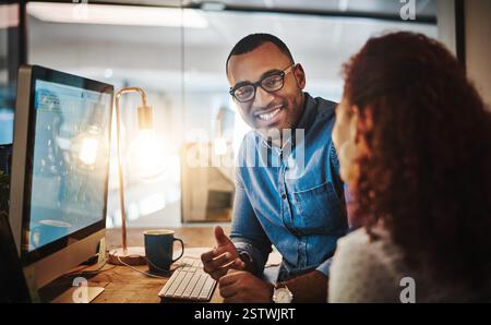 Training, intern or manager on computer for web design, startup website or coaching staff. Night, happy people and developer on pc for teaching Stock Photo