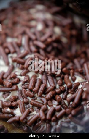 Close-up of chocolate sprinkle on a donut. Stock Photo
