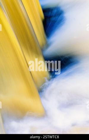 Blurred water in a waterfall in a river Stock Photo