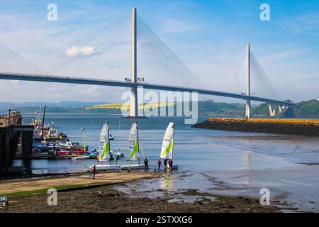 Queensferry Crossing South cable-stayed road bridge and sailing boats at Firth of Forth river estuary in Scotland, UK Stock Photo