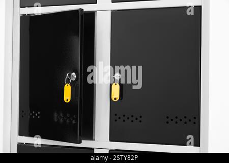 Modern lockers with bright keys indoors, closeup Stock Photo