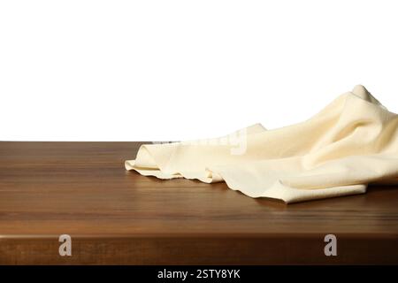 Beige tablecloth on wooden table against white background Stock Photo