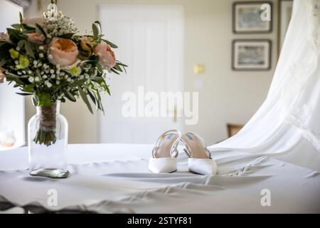 Wedding dress on a piano at a wedding ceremony. Stock Photo