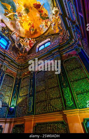 MILAN, ITALY - APRIL 11, 2022: Old skulls and bones in Ossuary of San Bernardino alle Ossa Church, on April 8 in Milan, Italy Stock Photo