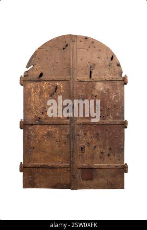 Aged rusted iron castle doors with arched top, visible battle damage, heavy padlock, and sturdy hinges on both sides, bearing marks of history and con Stock Photo