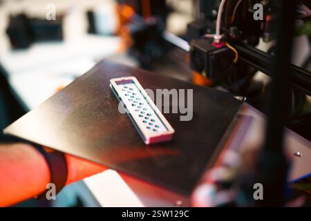 printer hand holding printed 3d object printing machine prototype home factory craft project Stock Photo