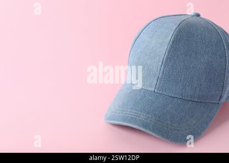 Stylish denim baseball cap on pink background. Mockup for design Stock Photo