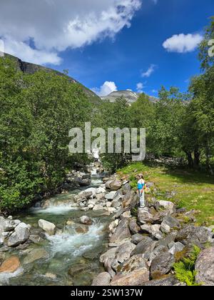 Exploring Norway's Breathtaking Mountain Stream on a Sunny Day Stock Photo