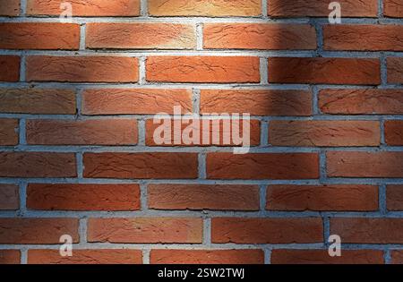 Red brick wall texture background and shadows Stock Photo