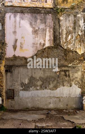 Closeup​ pattern​ of​ surface brick​ wall​ concrete plaster​ for​ vintage​ background. Colors ocher, grey. Vertical line Stock Photo