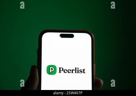 Dhaka, Bangladesh- 16 Sep 2024: Peerlist logo is displayed on smartphone. Peerlist is a professional network where you can showc Stock Photo