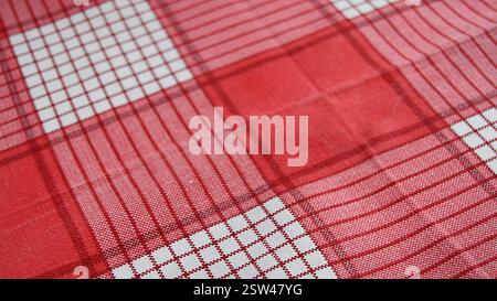 red checkered fabric background, close-up, selective focus Stock Photo
