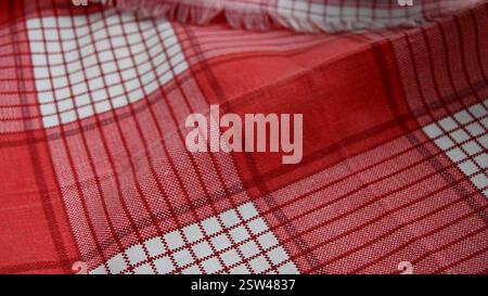 red checkered fabric background, close-up, selective focus Stock Photo