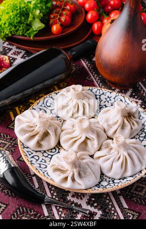 Georgian dumplings khinkali on traditional plate Stock Photo