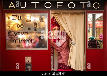 London, UK. 20th Feb, 2025. Organiser and fashion designer Florent Bidois poses in a self-designed pink outfit, at a 20th century inspired Autofoto machine. Colourwalk is an informal gathering of colourful, creative souls who meet, dressed in their fabulous colourful outfits to walk, talk and have fun. The meetings were initially started by artist Sue Kreitzman and friends a few years ago and are now organised by stylist and designer Florent Bidois. Credit: Imageplotter/Ģ����ý Live News Stock Photo