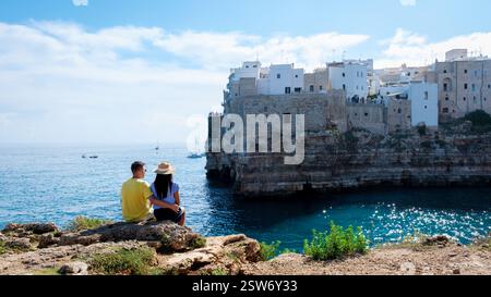 Couple enjoys breathtaking coastal views in Puglia, Italy on a sunny day Stock Photo