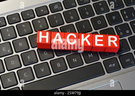 text 'HACKER' on a laptop keyboard. Cyber ​​security concept Stock Photo