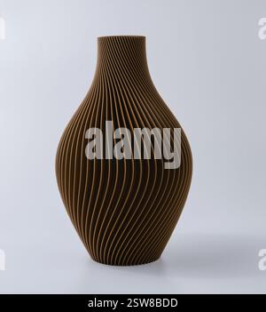 3D printed brown vase home decor with a flowing geometric texture Decorative Vase For Dried Flowers made from recycled plastic isolated Stock Photo