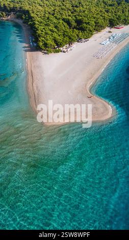Discover the serene beauty of Brac Island's tranquil sandy beach at sunset Stock Photo