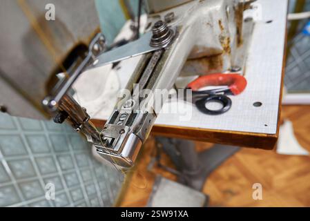 Crafting textiles with precision in a vintage sewing studio filled with charm and creativity Stock Photo