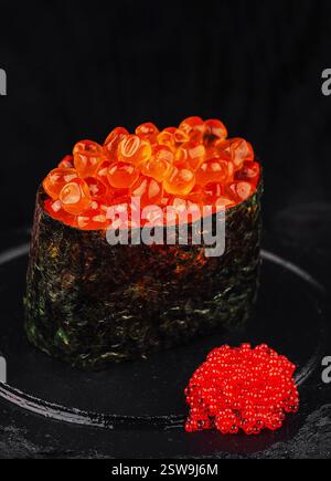 Flying fish roe maki Stock Photo - Alamy