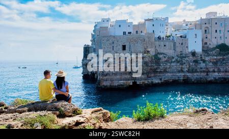 Couple enjoys breathtaking coastal views in Puglia, Italy on a sunny day Stock Photo