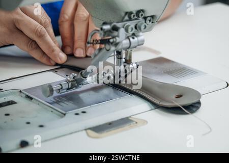 Sewing machine stitching fabric close up Craftsmanship in action Precision and detail in tailoring Stock Photo