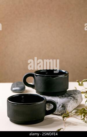 Set of empty grey ceramic cups Stock Photo
