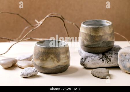 Set of empty grey ceramic cups Stock Photo